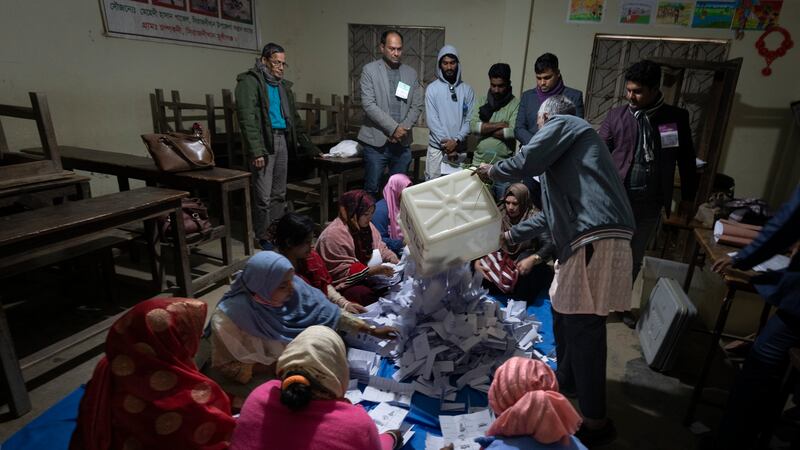 Bangladeshi polling officials empty the ballot boxes (Altaf Qadri/AP)
