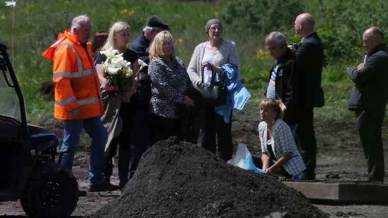 Relatives of Seamus Wright and Kevin McKee visit the site in Coghalstown, Co Meath, where the pair&#39;s bodies were found in June. Picture by Niall Carson, Press Association 