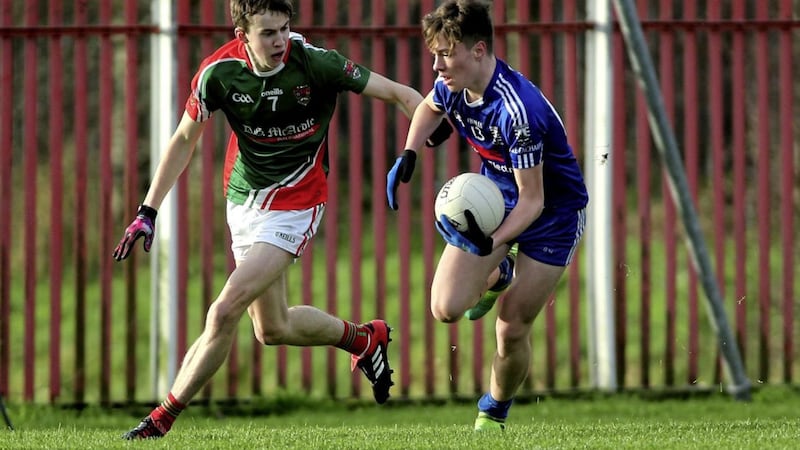Bellaghy&#39;s Charlie Diamond in action against Inniskeen&#39;s Conor Downey in yesterday&#39;s fonaCab Ulster Minor Football Tournament at St Paul&#39;s GAC, Belfast. Picture by Seamus Loughran 