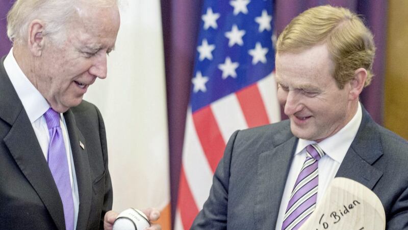 Taoiseach Enda Kenny welcomes then US Vice President Joe Biden to Government Buildings, Dublin at the start of a six-day visit in 2016 and gives him a gift of a hurling stick and sliothar. Picture by Barry Cronin/PA Wire 