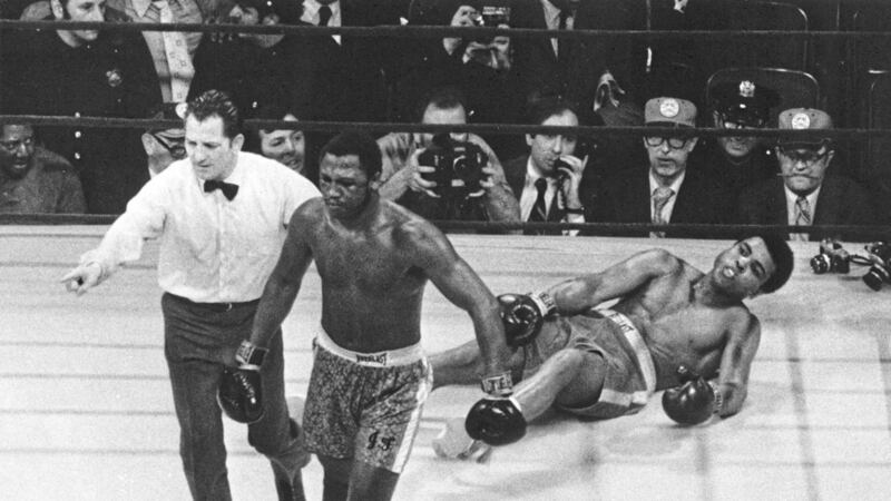 In this March 8 1971 file photo Joe Frazier is directed to a corner by referee Arthur Marcante after Frazier knocked down Muhammad Ali during the 15th round of the title bout in Madison Square Garden in New York. Frazier won the bout over Ali by decision. Frazier the former heavyweight champion who handed Ali his first defeat yet had to live forever in his shadow died after a brief final fight with liver cancer. He was 67. The family issued a release confirming the boxer's death on Monday night November 7 2011. (AP Photo/File)