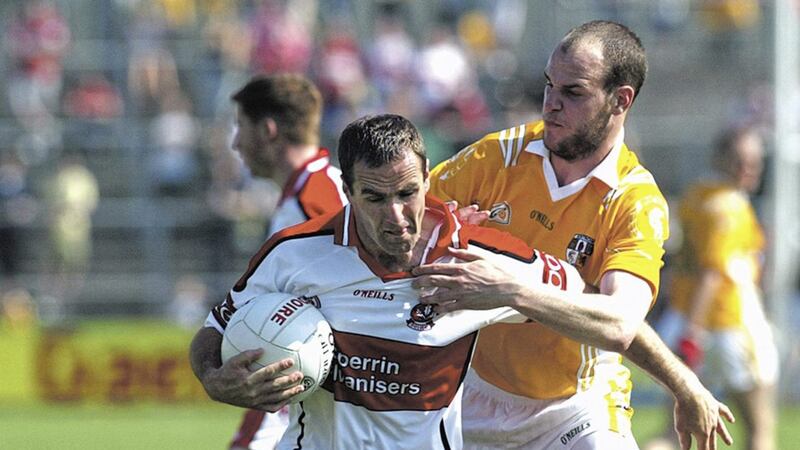 Derry&#39;s Sean Martin Lockhart holds off Antrim&#39;s Aodhan Gallagher in the 2007 Ulster Senior Football Championship clash at Casement Park 