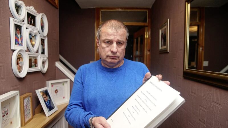 North Belfast man Gerard McCartan with a copy of the 2007 report ordered into the suicide of his 18 year-old son, Danny. 