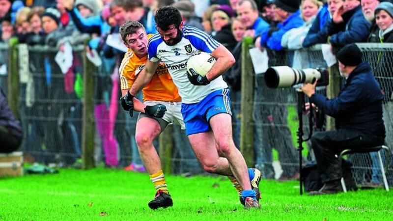 COYLE SPRING: Monaghan&rsquo;s Owen Coyle fends off the close attention of Antrim&rsquo;s Pat Branagan during yesterday&rsquo;s Bank of Ireland Dr McKenna Cup Section B encounter in Glenavy. Picture by Cliff Donaldson