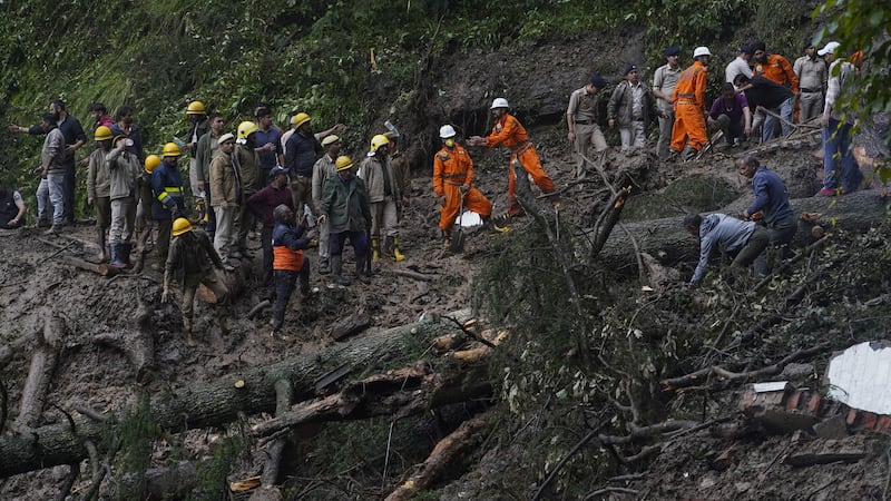 Authorities said the death toll could rise as they work to pull out those still trapped after the landslides (Pradeep Kumar/AP)