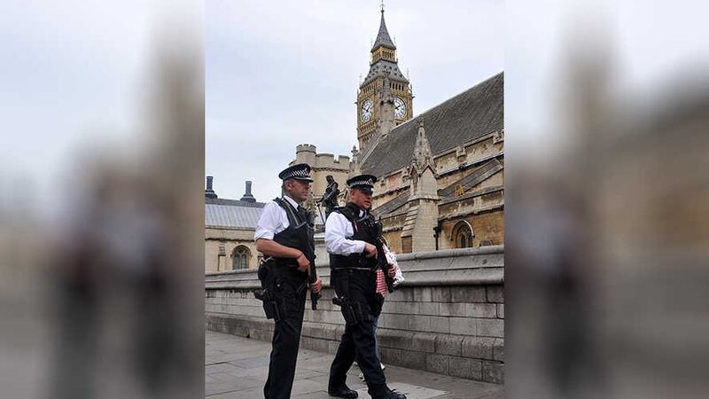 <span style="font-family: Arial, Verdana, sans-serif; ">Police officers patrol around Westminster</span>
