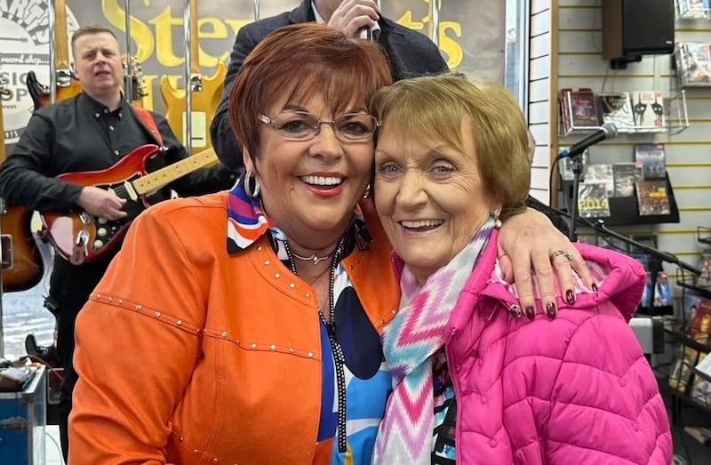 Susan McCann with lifelong friend Philomena Begley during the launch of her new album at Stewart's Music Shop, Dungannon