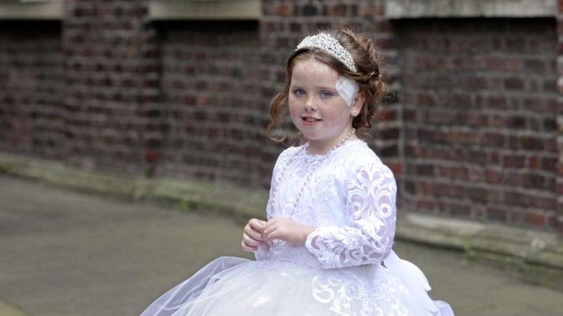 Annie McFadden made her First Holy Communion a week after being attacked by a dog in north Belfast, requiring 80 stitches to her head and body. Picture by Ann McManus 