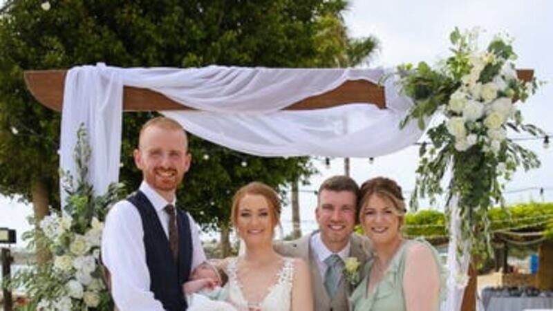 Bride and groom Michael and Gemma O’Shea with bridesmaid Lauren, her husband, and their baby, after airline Tui flew out her bridesmaid’s dress to save the day (TUI/PA)