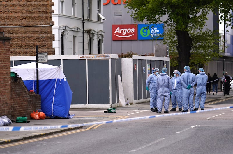Forensic investigators at the scene near the Tottenham Hotspur Stadium