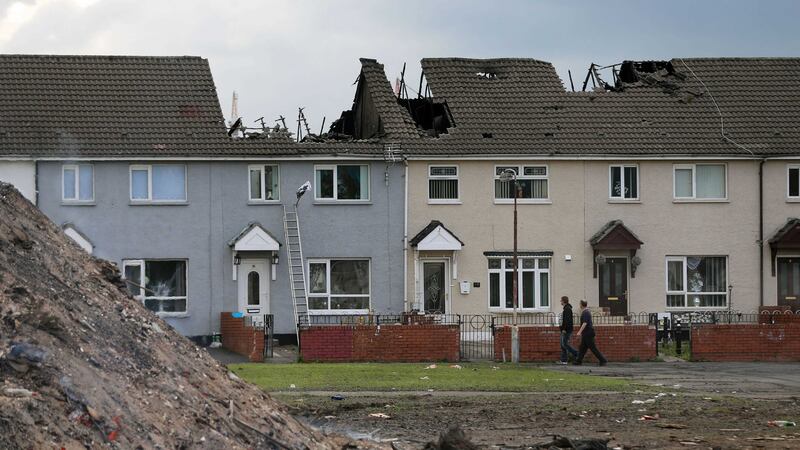 Two homes near Belfast's Shankill Road which were damaged by the bonfire lit on the 'Eleventh Night' as part of the annual Twelfth of July celebrations&nbsp;