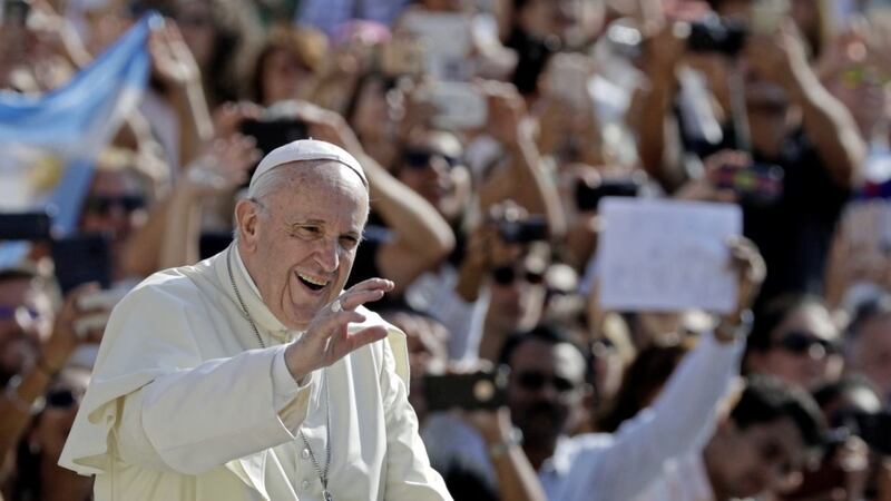 Pope Francis salutes as he arrives for his weekly general audience at the Vatican. Picture by AP/Andrew Medichini 