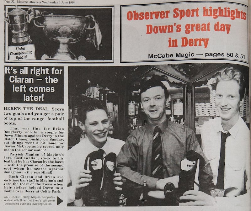 The back page of the <em>Mourne Observer</em>, showing publican Paddy Maginn standing between a beaming Brian Dougherty and Ciaran McCabe