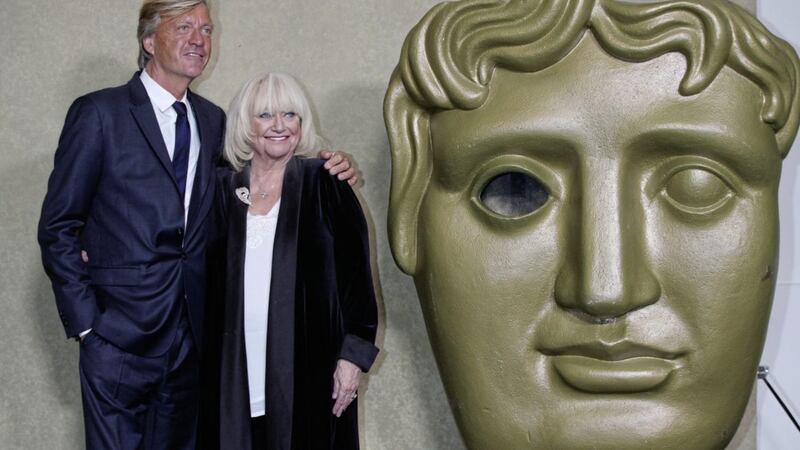TV titan Richard Madeley with wife Judy Finnigan and a giant Bafta statue 