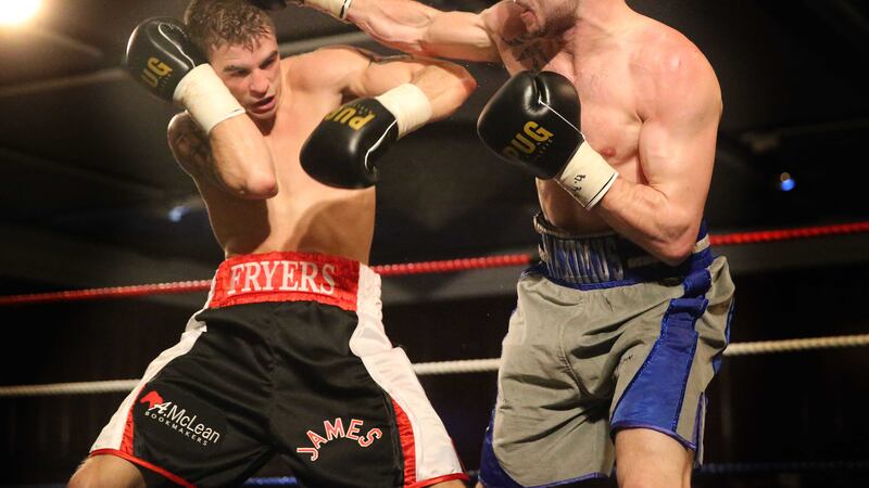 James Fryers and Maxi Hughes during their British super-featherweight title eliminator at the Europa Hotel in Belfast on Saturday night Picture: Hugh Russell