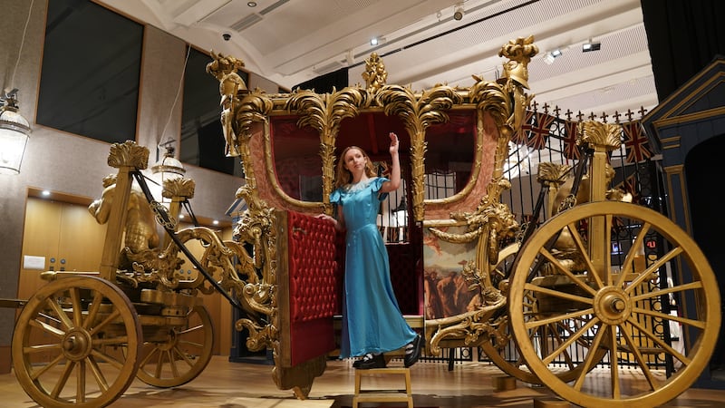 A reproduction of the Gold State Coach, which is part of the collection of more than 450 costumes, sets and props from the Netflix series The Crown