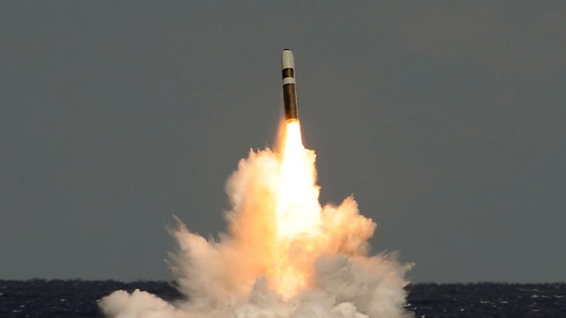 An unarmed Trident nuclear missile is fired from HMS Vigilant during a training exercise (Lockheed Martin/PA)