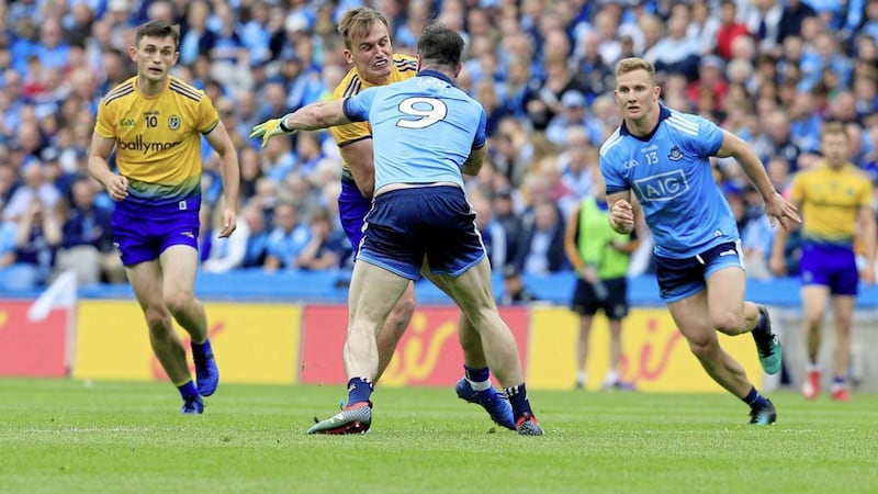 Dublin&#39;s Michael Darragh Macauley halts Roscommon&#39;s Enda Smith during the GAA All-Ireland Senior Football Championship Group 2 clash between the sides at Croke Park in Dublin on Saturday July 20 2019. Picture by Philip Walsh. 