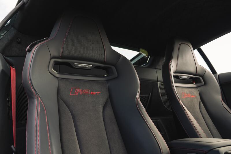 Bucket seats with red detailing are standard on the R8. (Audi)