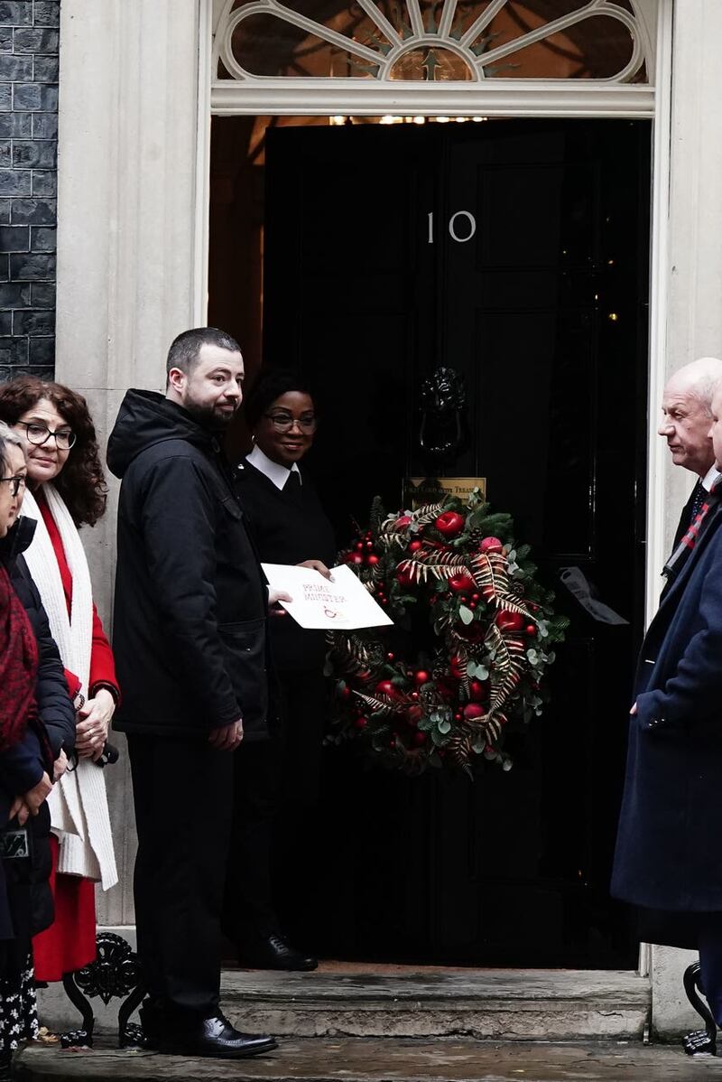 Jason Evans hands in a letter to Number 10 Downing Street 