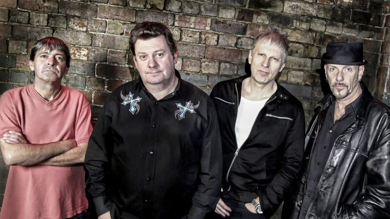 Stiff Little Fingers (with frontman Jake Burns, second left) will be back in Belfast next month 