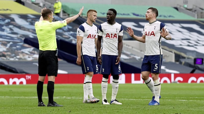 Tottenham Hotspur&#39;s Eric Dier and team-mates look disgusted at referee Peter Bankes after he awarded a penalty for handball. 