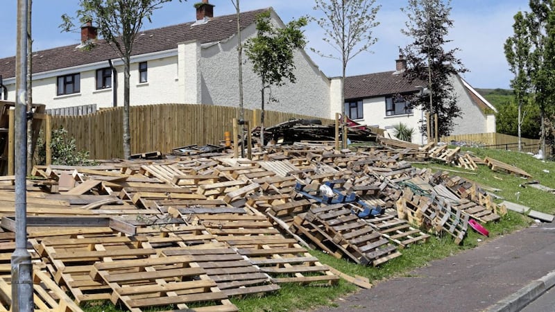 Wooden pallets stacked near homes on the Tyndale estate in north Belfast. 