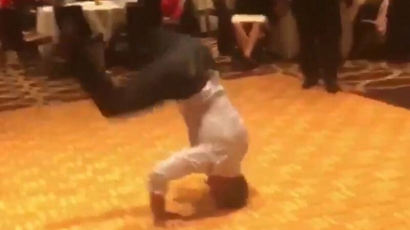48-year-old Gregg Kearney and his pals seemed to have hit up their 30th school reunion in style – yes, one of them even did a headstand.