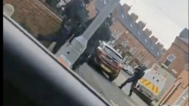 Police search for a handgun in west Belfast. 