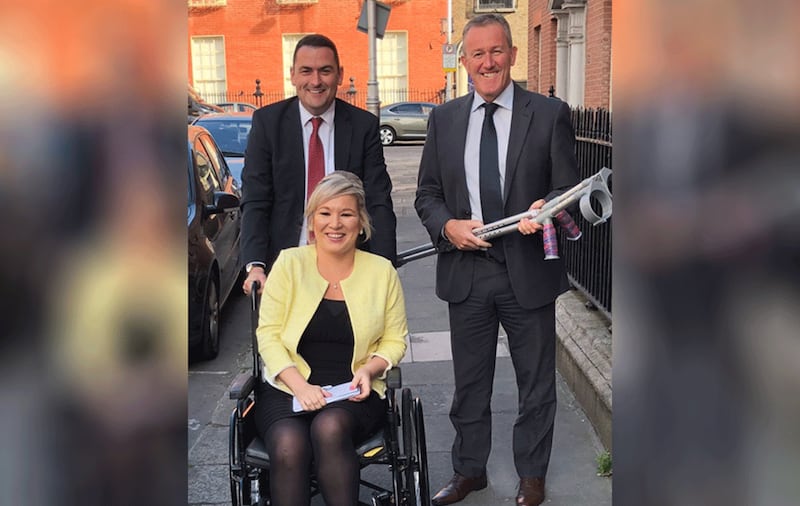 Sinn F&eacute;in vice-president Michelle O'Neill, who is recovering from a broken leg, met Simon Coveney in Dublin. Picture from Sinn F&eacute;in