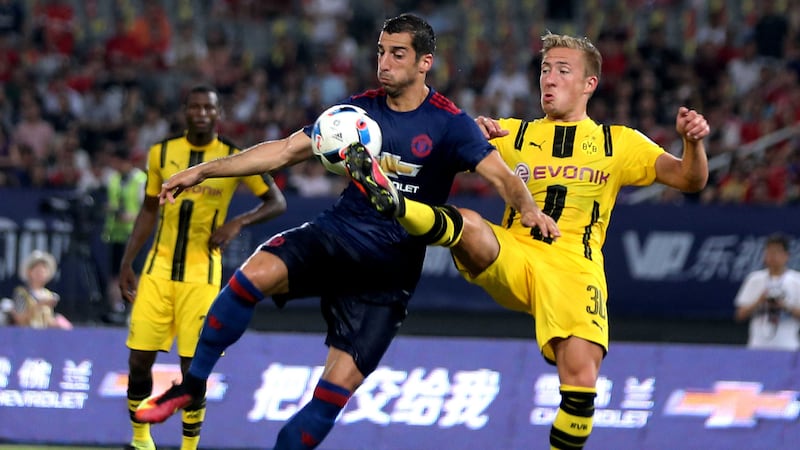 <span style="font-family: Arial, sans-serif; ">Manchester United's Henrikh Mkhitaryan is challenged by Borussia Dortmund's Felix Passlack during the Friday's International Champions Cup match in Shanghai&nbsp;</span><br style="font-family: Arial, sans-serif; " /><span style="font-family: Arial, sans-serif; ">Picture by AP</span>
