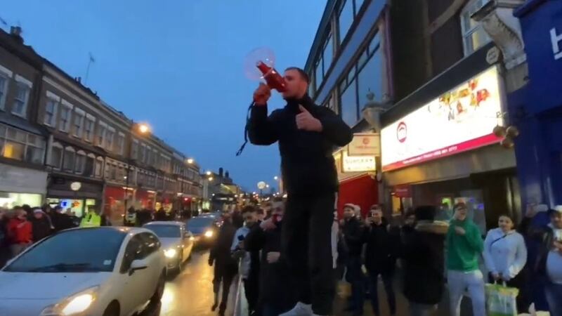 Video footage showed one particularly excited fan, who climbed on top of a rubbish bin and rallied fellow supporters with a megaphone.