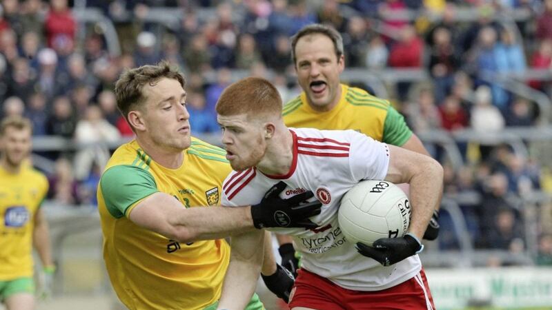 Hugh McFadden of Donegal in action with Cathal McShane of Tyrone during the Ulster Senior Football Championship semi final match played at Breffni Park. Picture Margaret McLaughlin. 
