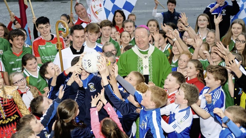 SPORTING CELEBRATION: St Patrick&#39;s Cathedral in Armagh hosted an unusual fixture on Sunday, with schools and 30 sport clubs in the parish joining in a &#39;Family of Sports&#39; procession. The celebration was part of the parish&#39;s preparations for next year&#39;s World Meeting of Families, with everyone attended encouraged to wear sporting colours or jerseys. Archbishop of Armagh Dr Eamon Martin led the celebration, along with Fr Peter McAnenly and Fr Thomas McHugh. The opening commentary was delivered by Charlie Vernon, who will play with Armagh Harps against Maghery in Sunday&#39;s GAA County Final. The Taylor Scallan School of Irish Dance was also involved, and music was led by Armagh Diocesan Youth Choir along with Malachi Cush and Plunkett McGartland. &quot;It was a very unique and joyous occasion as people gathered in huge numbers from all across the parish and beyond, to thank God for the gift of sport and to give praise for all of what we gain as a result of being involved in the great &#39;Family of Sports&#39;,&quot; said Fr Peter McAnenly. Picture by www.LiamMcArdle.com 