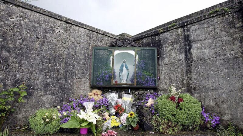 Flowers laid at the scene of a mass grave where the remains of almost 800 babies were found in Tuam, Co Galway 