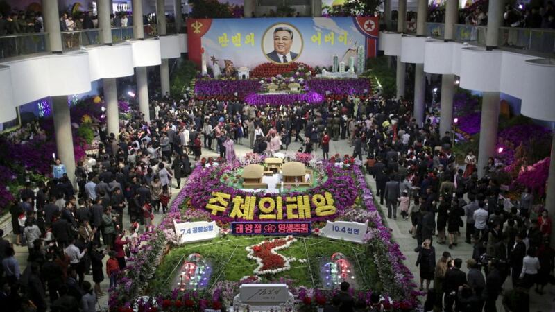 In this Sunday, April 16, 2017, photo, thousands of people visit a flower festival as part of celebrations for the 105th birth anniversary of their late leader Kim Il Sung in Pyongyang, North Korea. Tensions have spiked in recent weeks over North Korea&#39;s advancing nuclear technology and missile arsenal. But in Pyongyang, where war would mean untold horrors, where neighborhoods could be reduced to rubble and tens of thousands of civilians could be killed, few people seem to care much at all. (AP Photo/Wong Maye-E) 