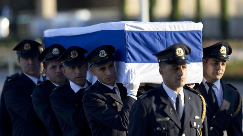 Members of the Knesset guard carry the coffin of former Israeli President Shimon Peres at the Knesset, Israel&#39;s Parliament, in Jerusalem, Thursday. Picture by Ariel Schalit, Associated Press 