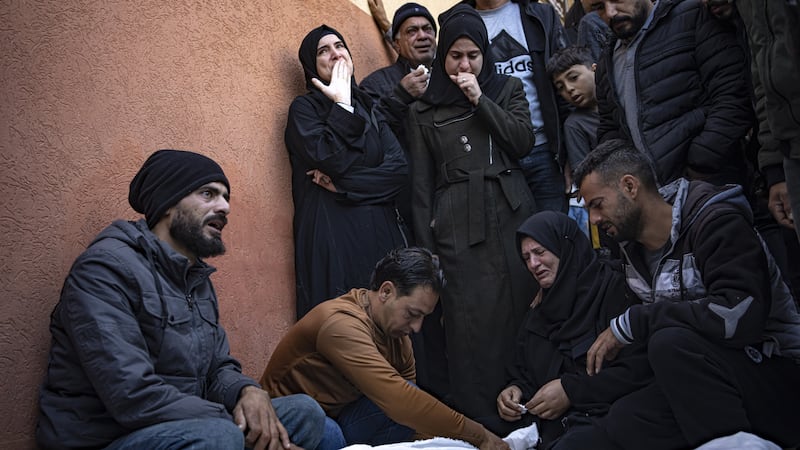 Palestinians mourn relatives killed in the Israeli bombardment (Fatima Shbair/AP)