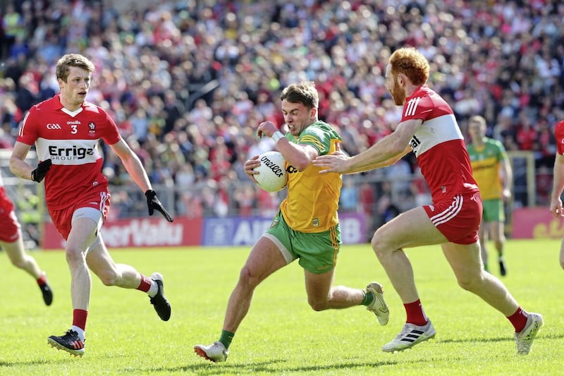 Derry Brendan Rogers and Conor Glass with Peadar Mogan of Donegal during the Ulster Senior Football Championship Final at Clones on Sunday 29th May 2022. Picture Margaret McLaughlin. 