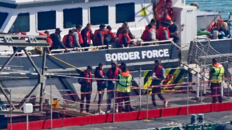 A group of people thought to be migrants are brought in to Dover, Kent, from a Border Force vessel following a small boat incident in the Channel on Thursday (Gareth Fuller/PA)