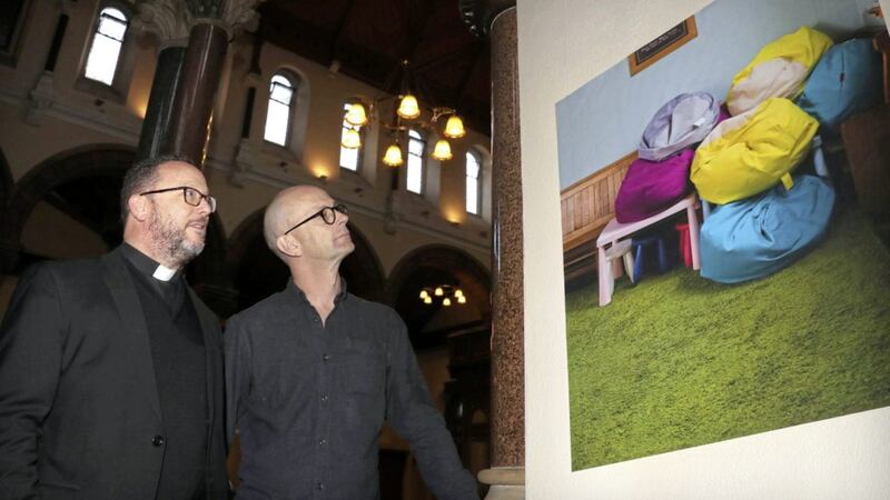 Fr Eugene O&#39;Neill, parish priest of St Patrick&#39;s Church in Belfast, and photographer Stephen Wilson at the launch of his photography exhibition yesterday. Picture by Declan Roughan 