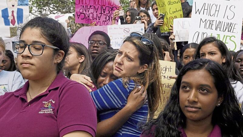 Florida school pupils walked out on Wednesday to protest following the deadly shooting at Marjory Stoneman Douglas High School a week earlier 