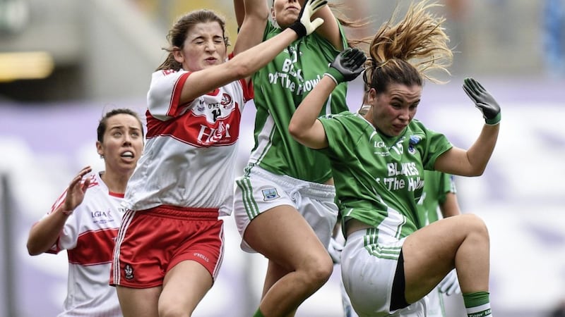 Jackie Donnelly of Derry in action against R&oacute;is&iacute;n O&#39;Reilly, centre, and Nuala McManus of Fermanagh during the TG4 Ladies Football All-Ireland Junior Championship final Picture by Cody Glenn/Sportsfile 