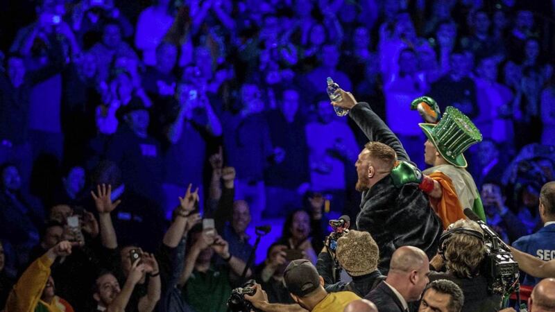 Michael Conlan celebrates with UFC star Conor McGregor
