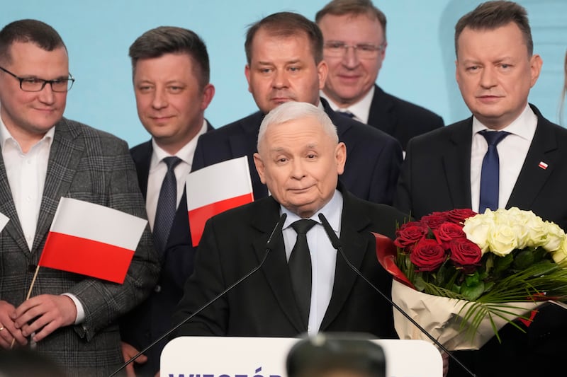 Conservative Law and Justice party leader Jaroslaw Kaczynski, centre, speaks to supporters during Poland’s local and regional elections in Warsaw (Czarek Sokolowski/AP)