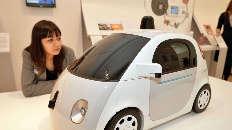 A woman studies a model of Google's driverless car. Picture by PA&nbsp;