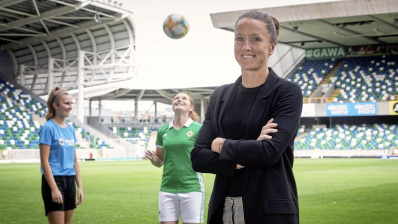 The then Manchester United women&#39;s first team coach Casey Stoney at Windsor Park in 2019, with Cerys Madden and Northern Ireland captain Marissa Callaghan in the background  
