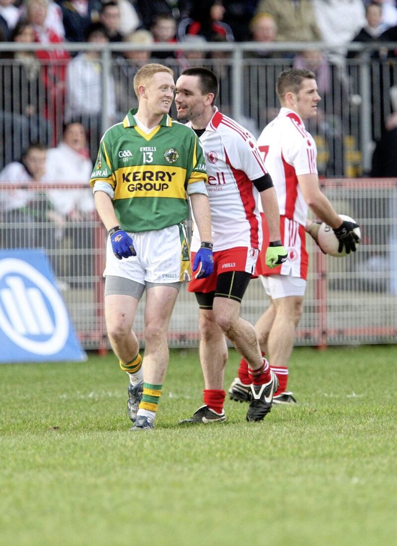 Tyrone's Ryan McMenamin (right) gets up close and personal with Kerry legend Colm Cooper.