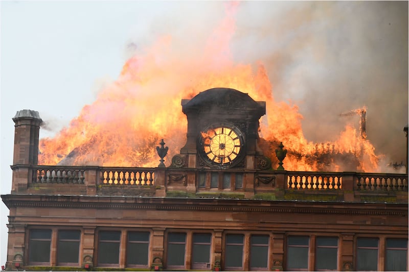 Flames sweep up to the top of Bank Buildings after a huge blaze destroys Primark in August.