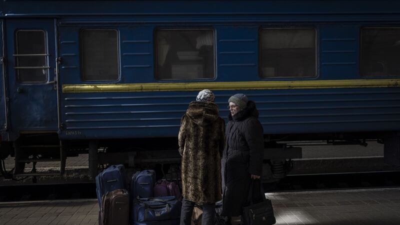 Two women escaping from the besieged city of Mariupol arrive at Lviv, western Ukraine, on Sunday, March 20, 2022 (AP Photo/Bernat Armangue)&nbsp;